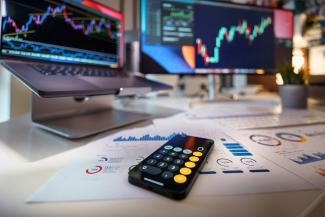 a remote control sitting on top of a table by Jakub Żerdzicki courtesy of Unsplash.