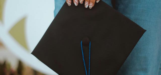 person in blue denim jeans holding black paper bag by ManuelTheLensman courtesy of Unsplash.